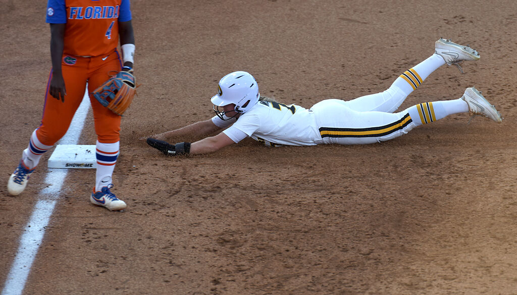 Missouri's Brooke Wilmes slides to third base